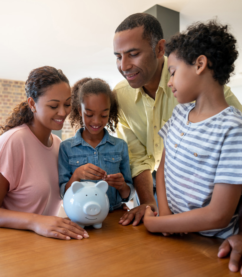 family counting money in piggy bank
