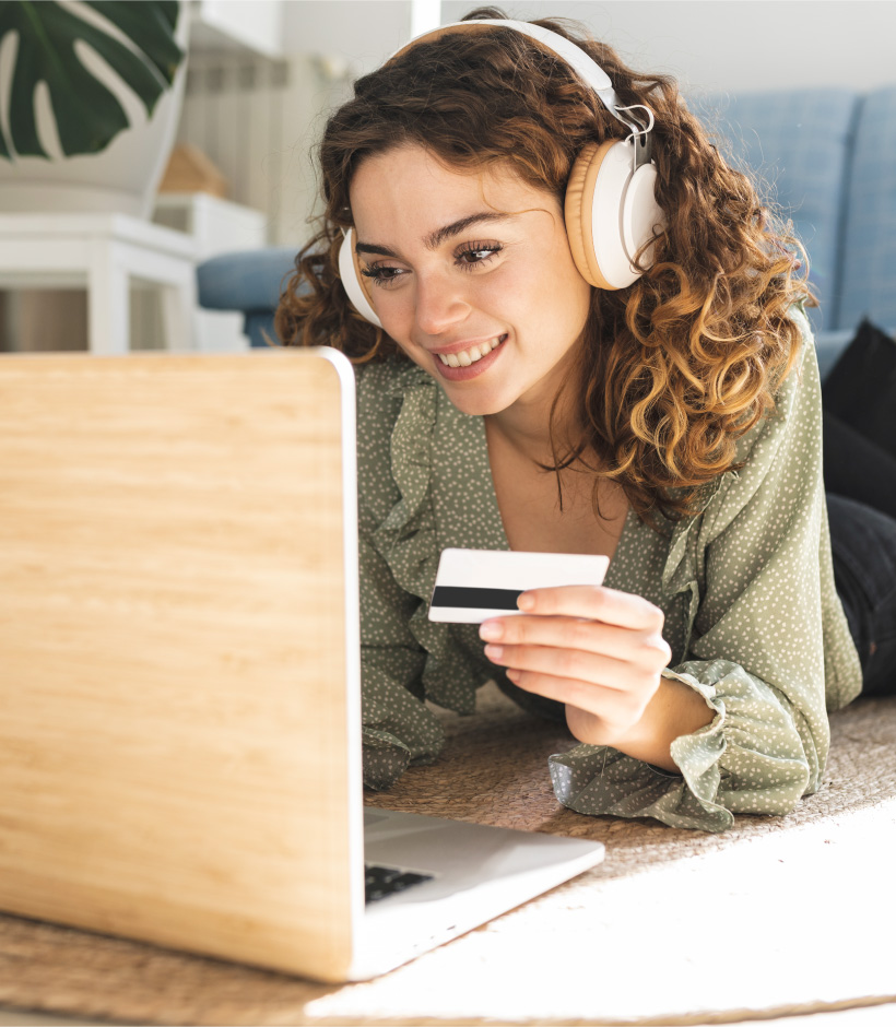 person reading card number at laptop