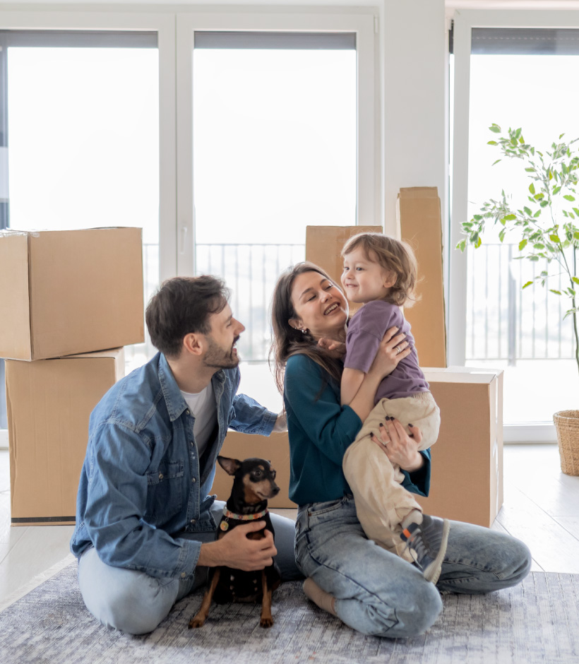 family in front of boxes in home
