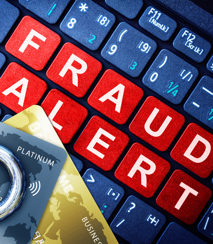 fraud alert key board with cards
