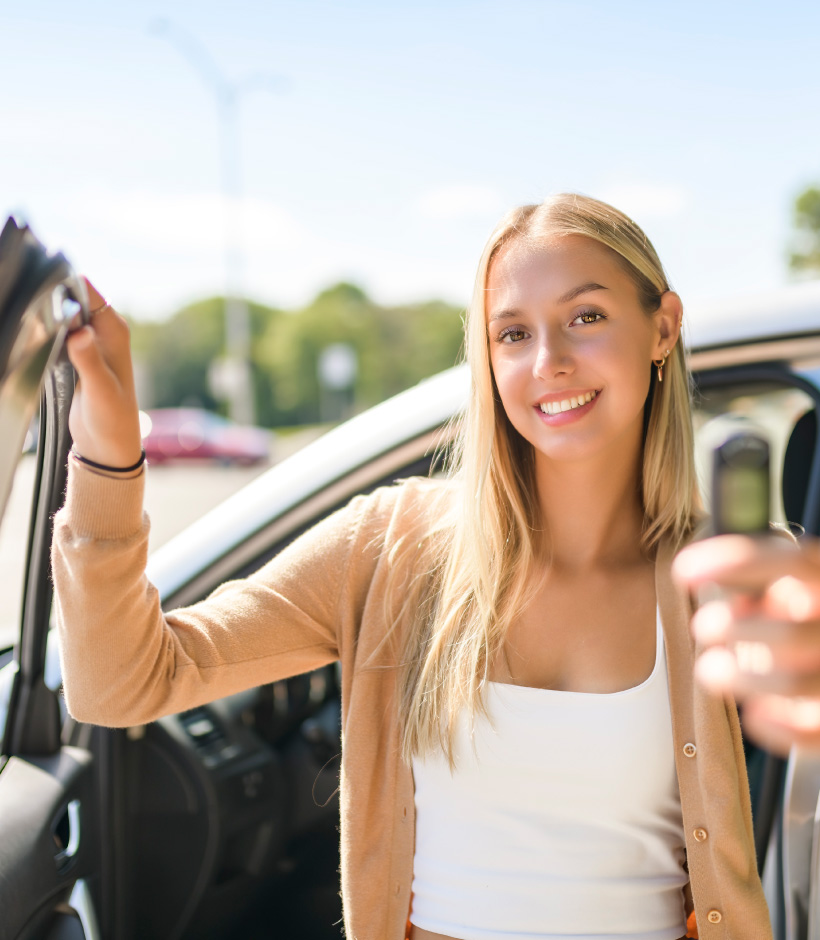 person with open car door