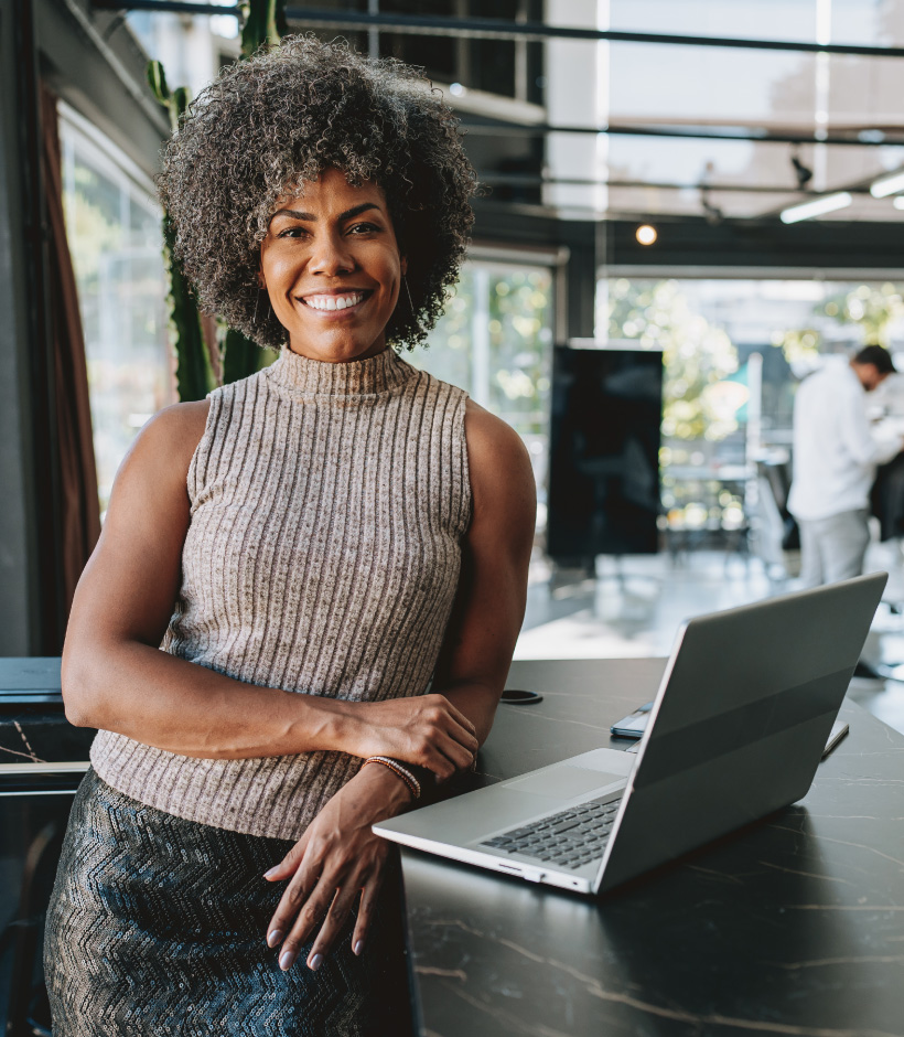 Women standing with laptop