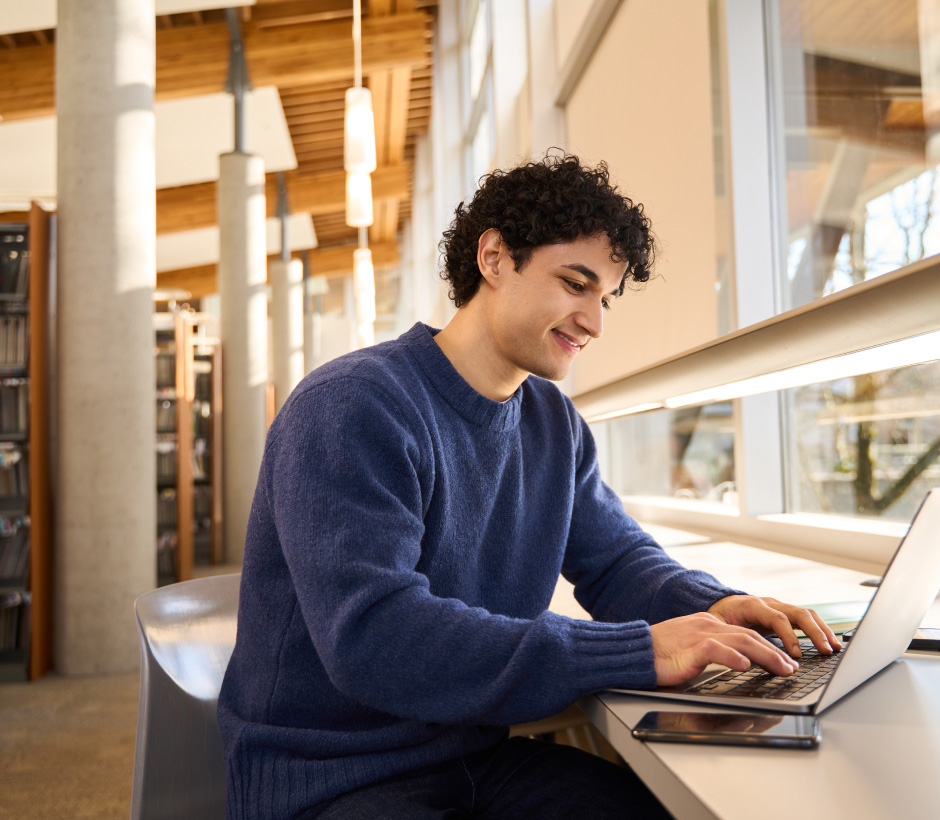 person typing on laptop