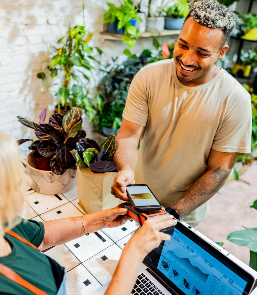 person tapping to pay with phone