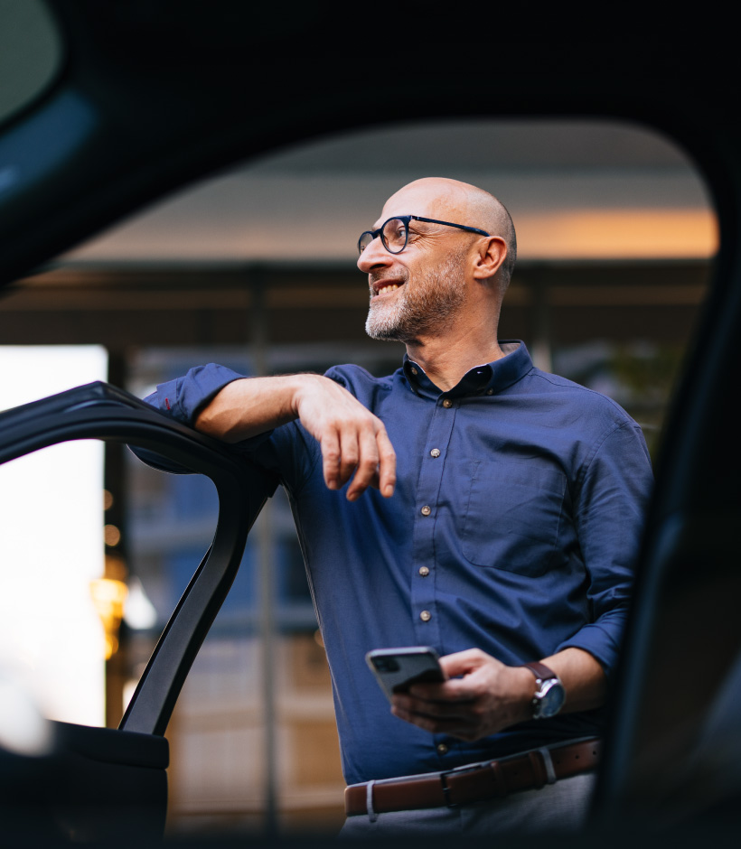 person standing with car door open