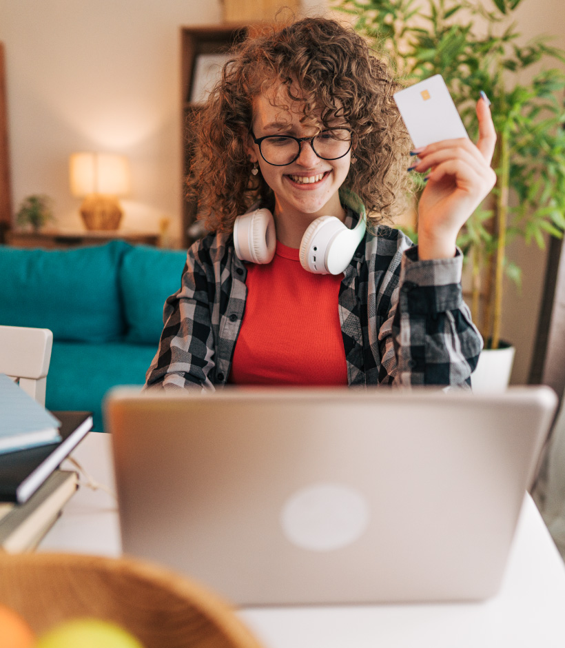 Teen holding debit card