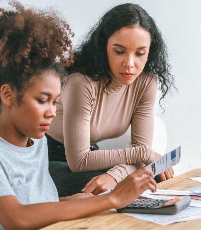 Parent and child working on finances