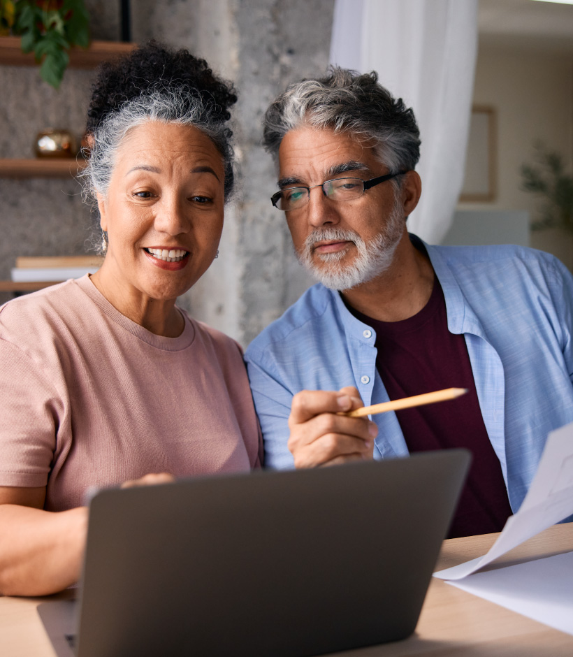 Older couple looking at laptop